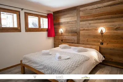 Un ou plusieurs lits dans un hébergement de l'établissement MARMOTTE 102 - Beau T4 pour 10, aux pieds des pistes
