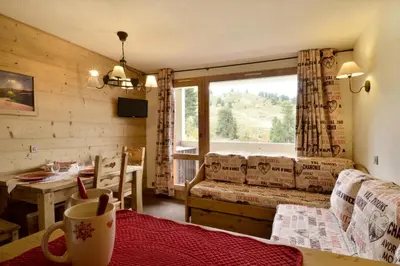 Coin salon dans l'établissement Résidence Onyx - Appartement rénové et tout confort · Accès direct aux pistes · Vue pistes MAE-3458