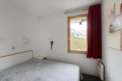 Un ou plusieurs lits dans un hébergement de l'établissement Résidence Callisto - Appartement charmant et tout confort · Accès direct aux pistes · Vue pistes MAE-3572