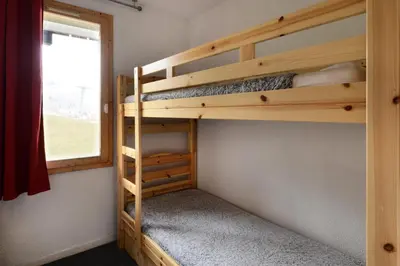 Un ou plusieurs lits dans un hébergement de l'établissement Résidence Callisto - Appartement charmant et tout confort · Accès direct aux pistes · Vue pistes MAE-3572