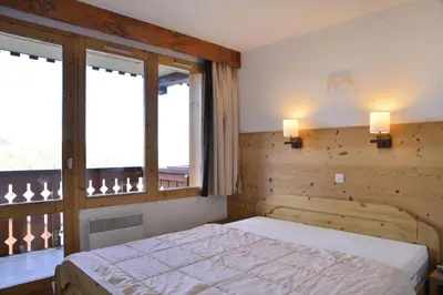Un ou plusieurs lits dans un hébergement de l'établissement Résidence Licorne - Appartement tout confort · Skis aux pieds · Vue pistes · Casier à skis MAE-3573