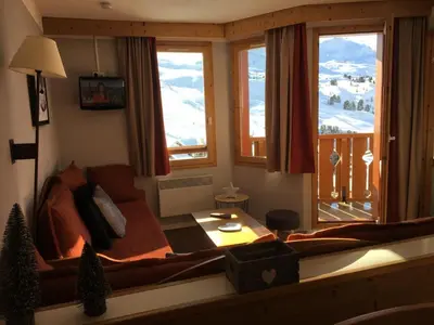 Coin salon dans l'établissement Résidence Callisto - Appartement tout confort · Skis aux pieds · Vue pistes MAE-3668