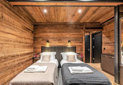 Un ou plusieurs lits dans un hébergement de l'établissement Chalet Monts by Les Etincelles