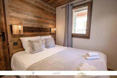 Un ou plusieurs lits dans un hébergement de l'établissement MARMOTTE 101 - Appartement pour 6, aux pieds des pistes