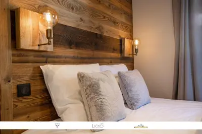 Un ou plusieurs lits dans un hébergement de l'établissement MARMOTTE 101 - Appartement pour 6, aux pieds des pistes