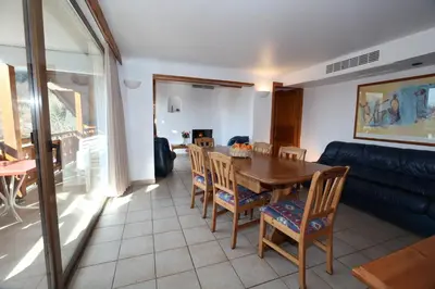 Coin salon dans l'établissement Les Chalets du Bouquetin - Marmotte