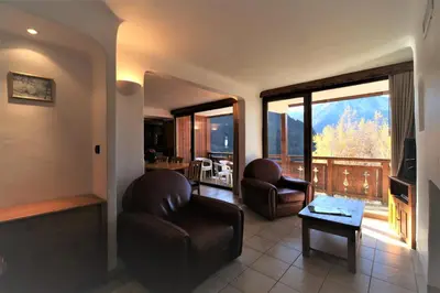 Coin salon dans l'établissement Les Chalets du Bouquetin - Lynx
