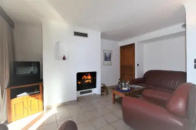 Télévision ou salle de divertissement dans l'établissement Les Chalets du Bouquetin - Lynx