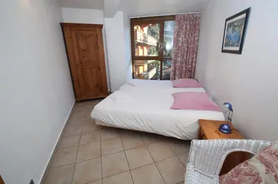 Un ou plusieurs lits dans un hébergement de l'établissement Les Chalets du Bouquetin - Ecureuil