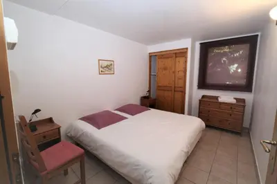Un ou plusieurs lits dans un hébergement de l'établissement Les Chalets du Bouquetin - Ecureuil