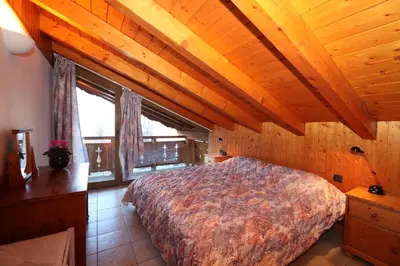Un ou plusieurs lits dans un hébergement de l'établissement Les Chalets du Bouquetin - Blaireau