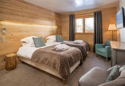 Un ou plusieurs lits dans un hébergement de l'établissement Madame Vacances Chalet Acajuma