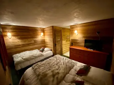 Un ou plusieurs lits dans un hébergement de l'établissement chalet la grange