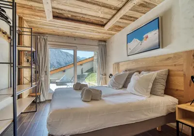 Un ou plusieurs lits dans un hébergement de l'établissement Chalet Ancolie