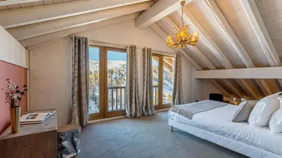 Un ou plusieurs lits dans un hébergement de l'établissement Chalet Hugo by Les Etincelles