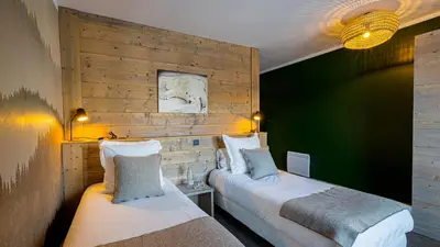 Un ou plusieurs lits dans un hébergement de l'établissement Chalet Juliette by Les Etincelles