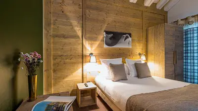 Un ou plusieurs lits dans un hébergement de l'établissement Chalet Juliette by Les Etincelles
