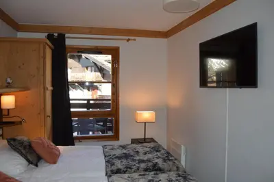 Un ou plusieurs lits dans un hébergement de l'établissement Appartement Standing 5* Arc 1950