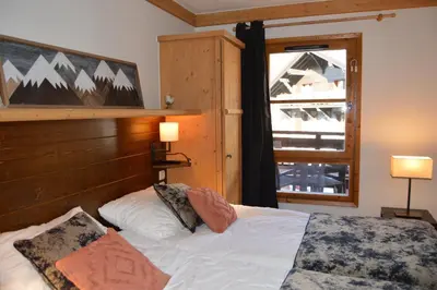 Un ou plusieurs lits dans un hébergement de l'établissement Appartement Standing 5* Arc 1950