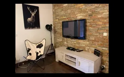 Télévision ou salle de divertissement dans l'établissement Mont Blanc