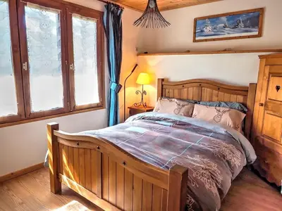 Un ou plusieurs lits dans un hébergement de l'établissement Chalet Soleil