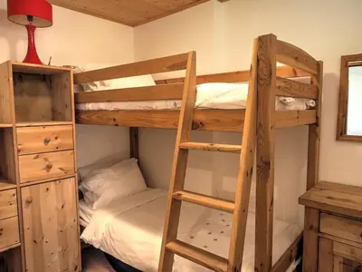 Un ou plusieurs lits dans un hébergement de l'établissement Chalet Soleil