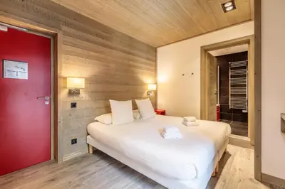 Un ou plusieurs lits dans un hébergement de l'établissement Victoria Lodge, Friendly Hotel