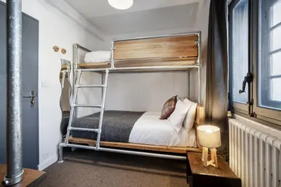 Un ou plusieurs lits dans un hébergement de l'établissement CHALET AUBERGE - Les Mélèzes