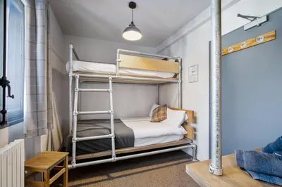 Un ou plusieurs lits dans un hébergement de l'établissement CHALET AUBERGE - Les Mélèzes