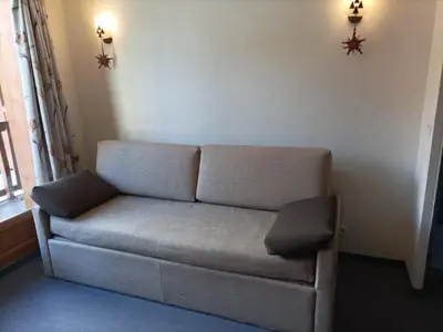 Coin salon dans l'établissement Résidence Les Alpages 4 étoiles - Appartement 4 personnes - Piscine, Hammam, Sauna, Jacuzzi - ValCenis 73480