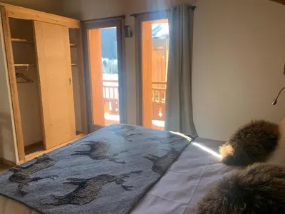 Un ou plusieurs lits dans un hébergement de l'établissement Alpine Chalet with Spa and pets
