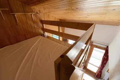 Un ou plusieurs lits dans un hébergement de l'établissement Résidence Onyx - Appartement spacieux et chaleureux · Skis aux pieds · Vue pistes · Avec mezzanine MAE-3354