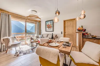 Coin salon dans l'établissement Résidence Les Nouveaux Alpages - Appartement très confortable avec accès SPA inclus MAE-8224