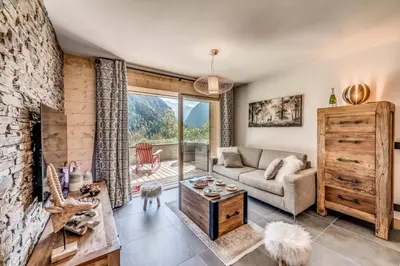 Coin salon dans l'établissement Résidence Les Nouveaux Alpages - Appartement 4 avec accès au SPA inclus MAE-8234