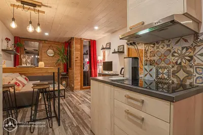 Cuisine ou kitchenette dans l'établissement Le Cocon de l'Arcelle