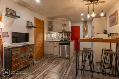 Cuisine ou kitchenette dans l'établissement Le Cocon de l'Arcelle