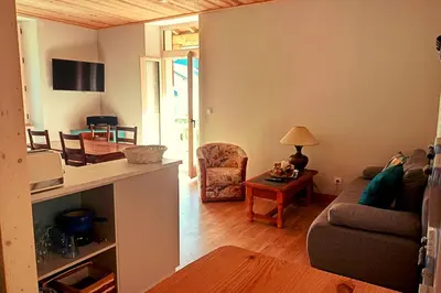 Télévision ou salle de divertissement dans l'établissement Le Balcon du grand bec