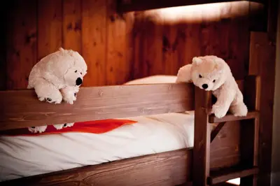 Un ou plusieurs lits dans un hébergement de l'établissement Hôtel Les Barmes De l'Ours