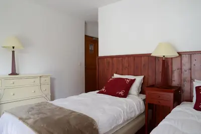 Un ou plusieurs lits dans un hébergement de l'établissement Goélia Les Chalets des Deux Domaines