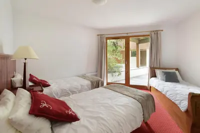 Un ou plusieurs lits dans un hébergement de l'établissement Goélia Les Chalets des Deux Domaines
