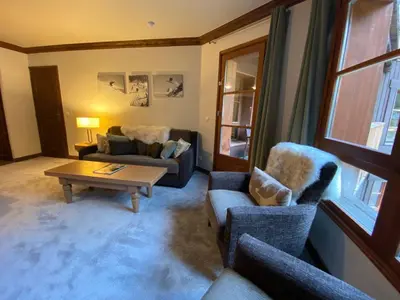 Coin salon dans l'établissement Arc 1950 - Appartement Premium Rénové - Manoir Savoie
