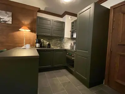 Cuisine ou kitchenette dans l'établissement Arc 1950 - Appartement Premium Rénové - Manoir Savoie