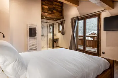 Un ou plusieurs lits dans un hébergement de l'établissement Chalet Saint Maurice - piscine privée & jacuzzi