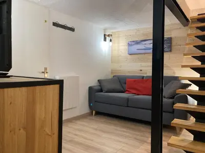 Coin salon dans l'établissement MyHome - Génépis 36 - Super T4 8 pax skis aux pieds - Val Claret