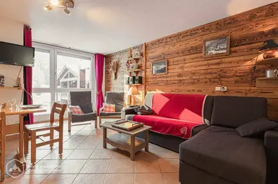 Coin salon dans l'établissement Résidence Le Pied des Pistes C6