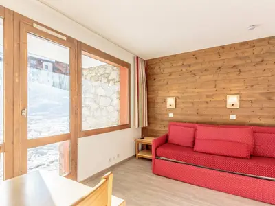 Coin salon dans l'établissement Appartement 4 pers, accès direct pistes, parking inclus - FR-1-351-148