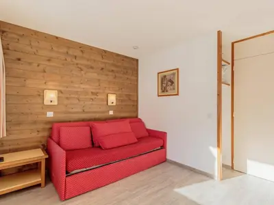 Coin salon dans l'établissement Appartement 4 pers, accès direct pistes, parking inclus - FR-1-351-148