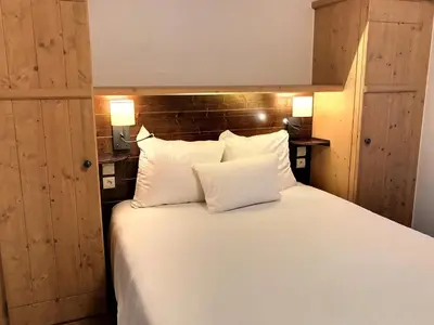 Un ou plusieurs lits dans un hébergement de l'établissement Superbe Appartement 6 personnes Ski-in Ski-out Arc 1950