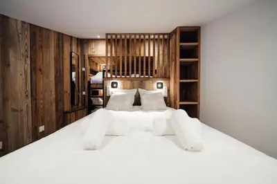 Un ou plusieurs lits dans un hébergement de l'établissement Studio Interlude by ExplorHome