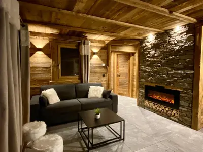 Coin salon dans l'établissement Chalet Les Cocales - Séjour et nuitées - Appartement Pin Cembro